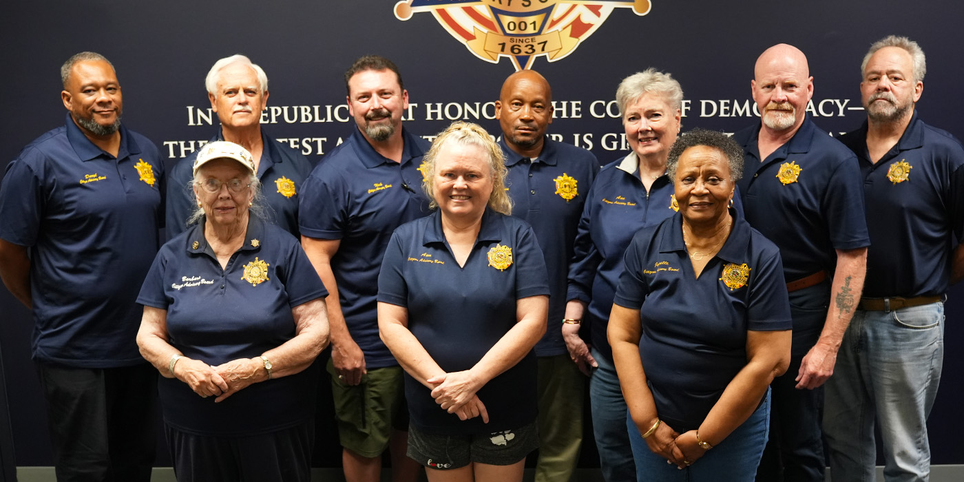 Citizen Advisory Class standing in front of American Flag