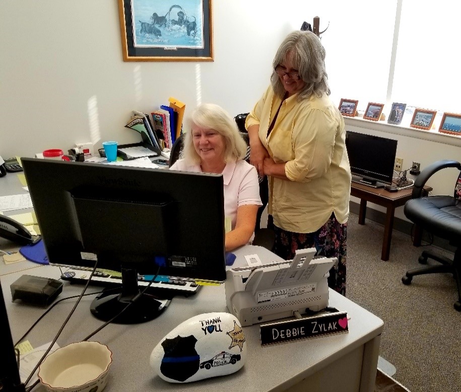 Civilian staff working in an office at the sheriff's department